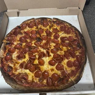 a pepperoni pizza in a box