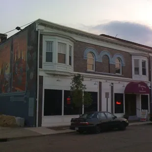 a car parked in front of the building