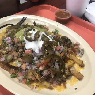 Hand cut fries thrown on the grill with the fixings including carne asada  08/04/2019