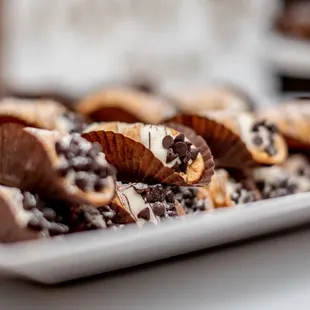 a plate of chocolate covered cookies