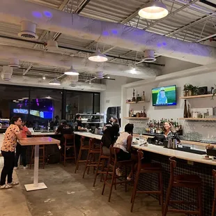 people sitting at the bar