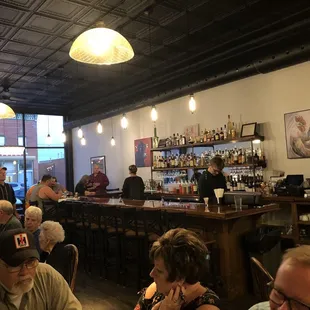 eople sitting at the bar