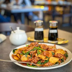 pan fried rice cake with shredded pork and spinach