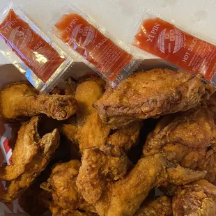 15 mixed chicken in the box! Their hot sauce packets!