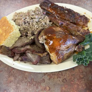 Barbecue platter with ribs, chop, brisket and cornbread
