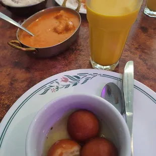 Chicken tikki masala, mango lassi, and gulam jamon