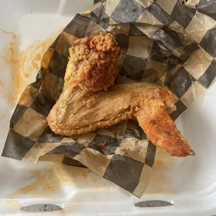 I forgot to take a picture of the chicken when we first got it but look how huge this chicken wing is compared to the to-go container!