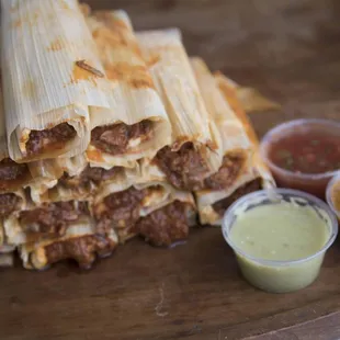 a stack of quesadillas with sauces