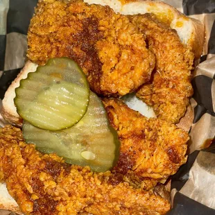 a fried chicken sandwich with a pickle