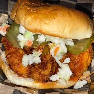 a chicken sandwich with coleslaw