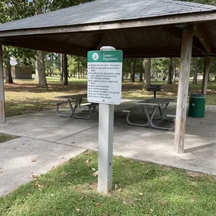 Covered shelter with picnic tables