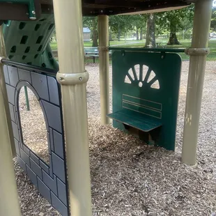Use of space under the playground for imaginative play