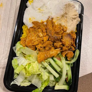 Build Your Bowl: Chicken Shawarma, Our House Made Garlic Sauce, Our House Made Ranch, Hummous, Lettuce, Cucumber, Yellow Rice