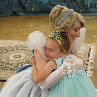 Cinderella gives a big princess hug at story time in Wichita