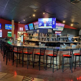bar seating and televisions