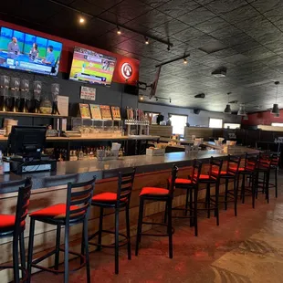 bar seating and televisions