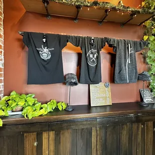 Gift shop with a sign that lists prices for items.