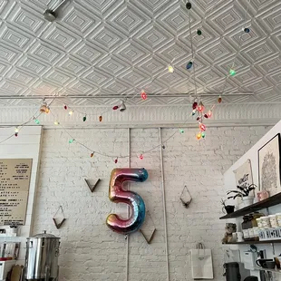 the number 5 hanging from the ceiling