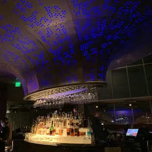 a bar with a lot of blue lights