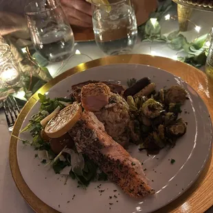 Salmon, mushroom risotto, tri-tip, roasted veggies and arugula salad