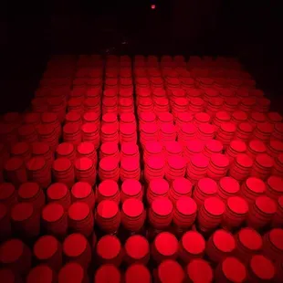rows of red lit barrels
