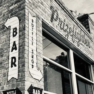 a black and white photo of a brick building