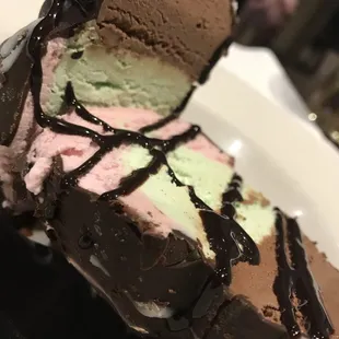 Spumoni Bomba. Strawberry, chocolate, and pistachio gelato surrounded by a hard chocolate shell. Awesome!!
