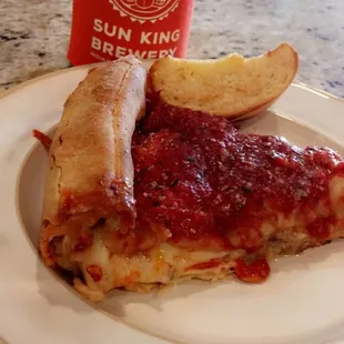 Stuffed pizza and garlic break. Pizza AWESOME!! Garlic bread is weak. Take Home and watch the game!