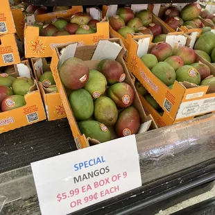 a display of mangos for sale