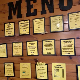 Sandwich selections are framed and mounted next to the ordering counter.