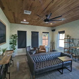 a living room with a ceiling fan