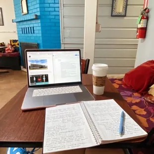 a woman&apos;s legs and a laptop on a desk