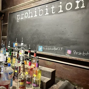 bottles of alcohol lined up on a table