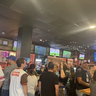 a large group of people at a bar