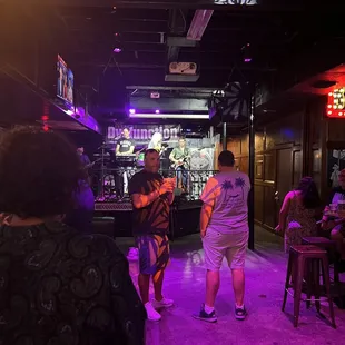 two men and a woman dancing