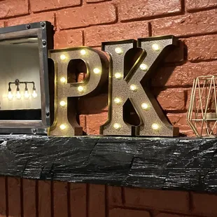 the letters pk on a brick wall
