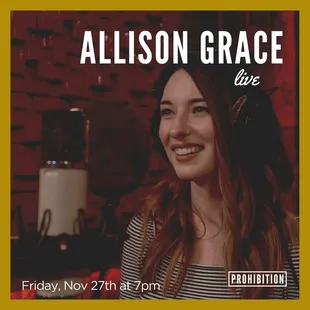 a woman smiling in a recording studio