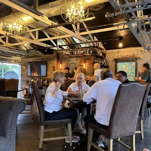 a group of people sitting at a table