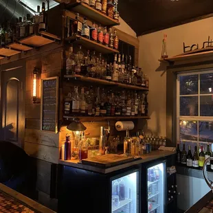 a bar with bottles of alcohol