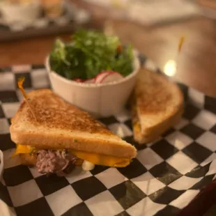Short Rib Grilled Cheese, with a side salad.