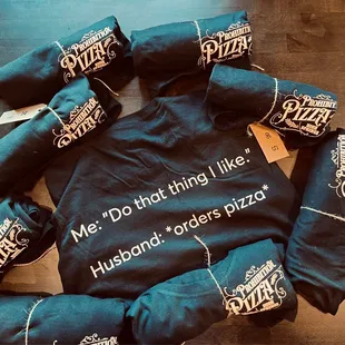 a bag of pizza wrapped in black fabric with the words me do that thing like husband orders pizza