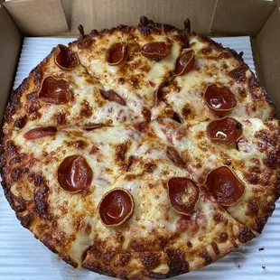 a pepperoni pizza in a box