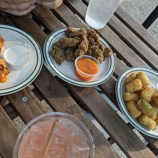 Happy hour bites $5 each- wings, popcorn chicken and tots