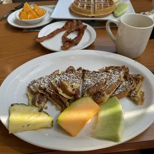 Breakfast cinnamon raisin crunch Bach toast with a side of bacon