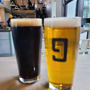 two glasses of beer on a table