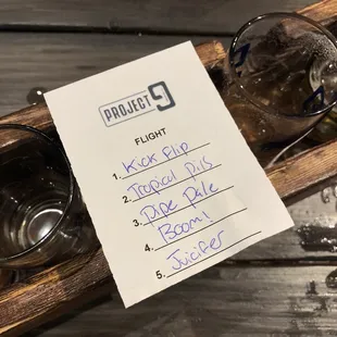 a flight of beer glasses