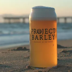 a glass of beer on the beach