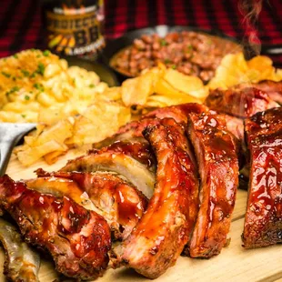 ribs and sides on a cutting board