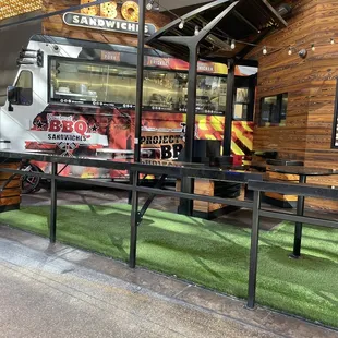 a food truck parked in front of a restaurant