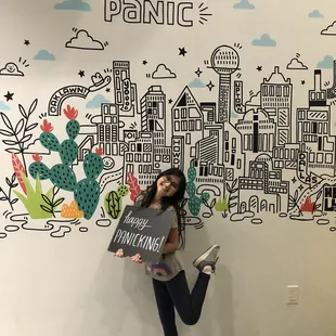 Daughters first escape room ! Posing at the wall of the Project Panic.